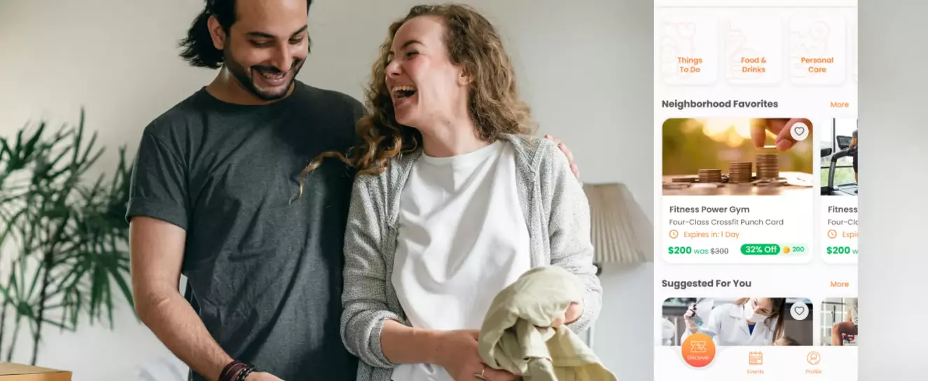 Couple laughing while using Rentopia app on smartphone, showcasing strategic branding and user-friendly interface for improved rental experience